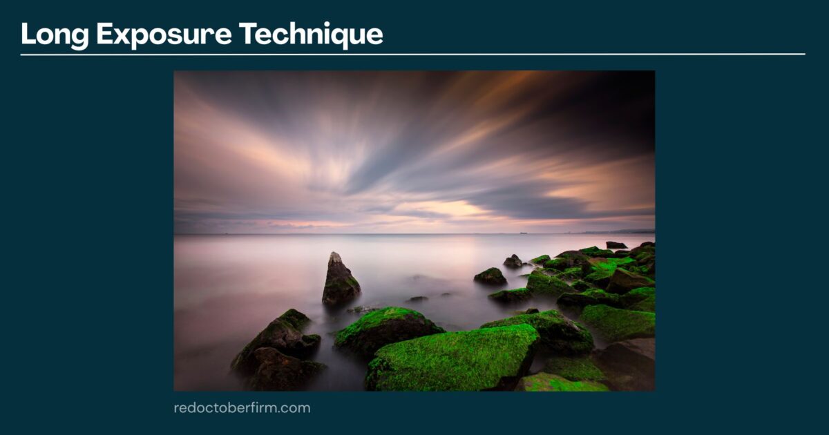 Long Exposure Photo Of A Rocky Shoreline With Smooth Water And Streaked Clouds, Featuring Green Moss On The Rocks Under A Dramatic Sky.