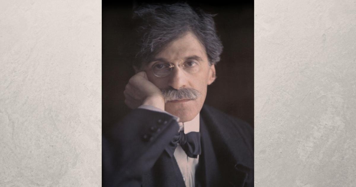 A  Portrait Of A Man With Distinctive Facial Hair.