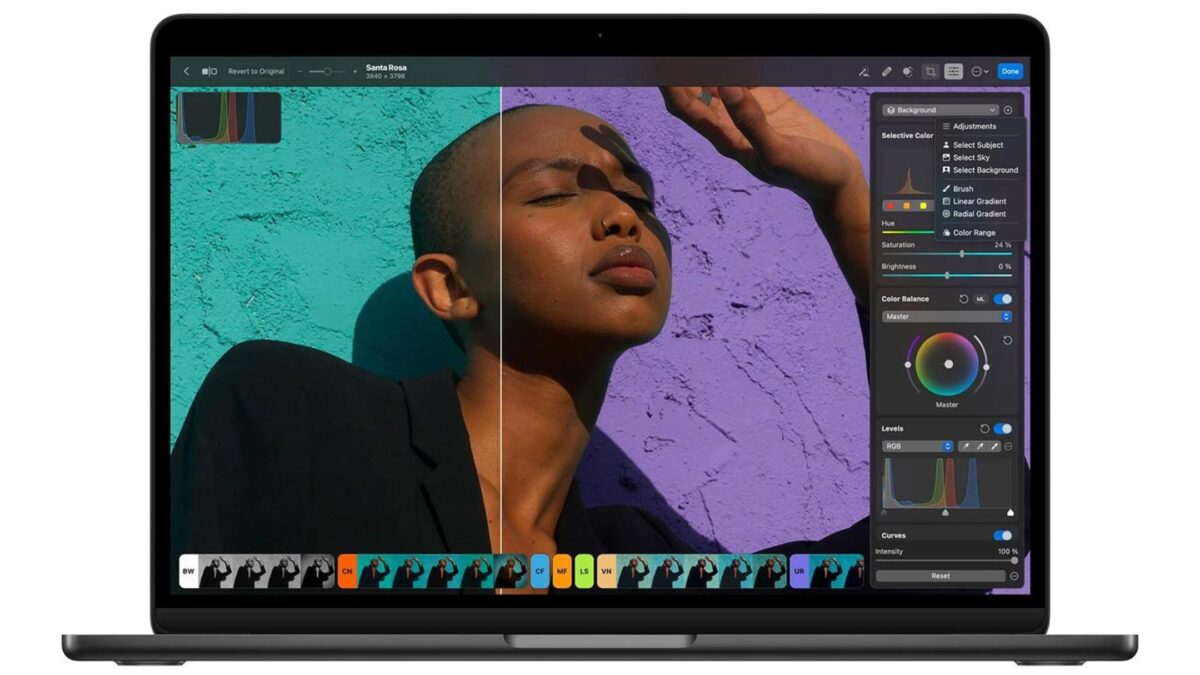 A Laptop Adorned With A Woman'S Face For Photo Editing Purposes.