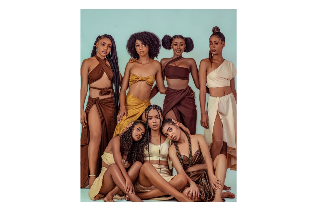 A Group Of Women Striking Poses For A Photo.