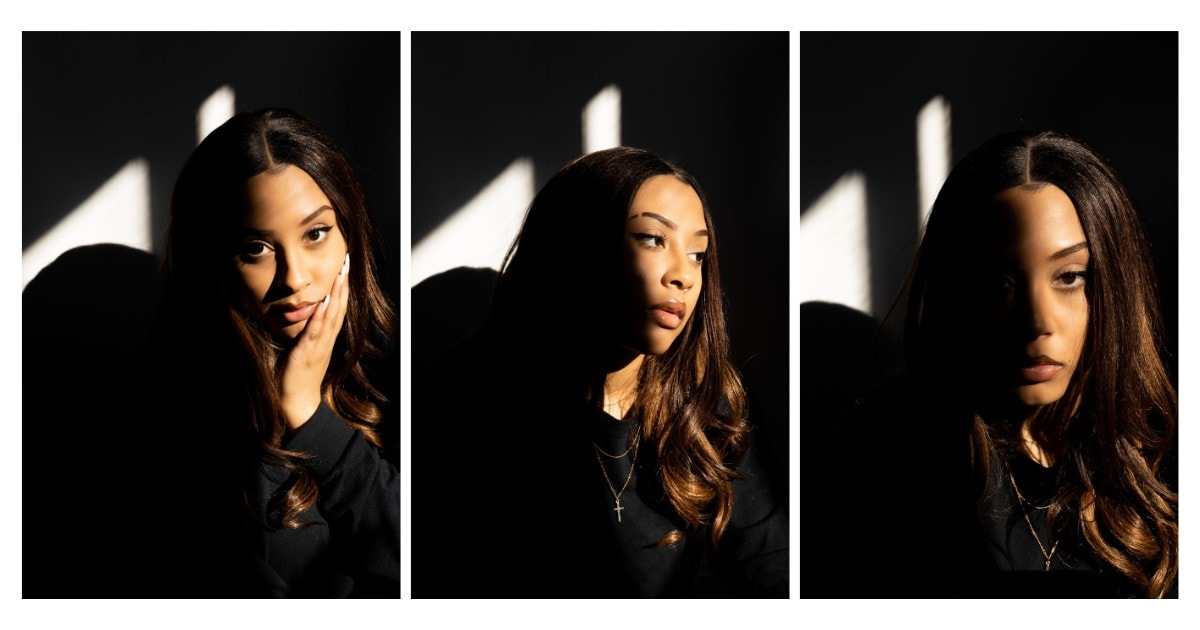 A Woman Strikes Various Poses For A Picture In The Shadows.