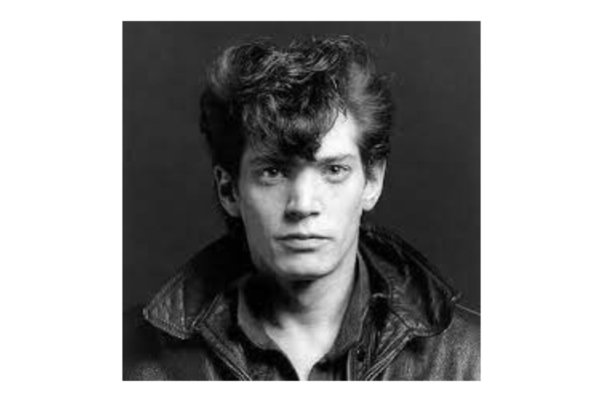 A Black And White Photo Of A Man In A Leather Jacket, Demonstrating Why Photography Is An Art.