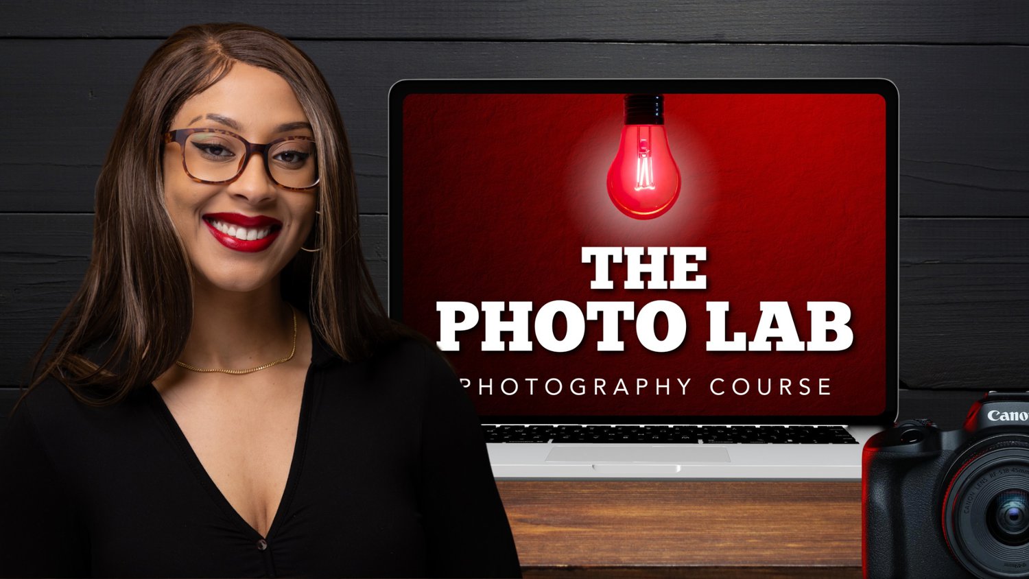 The Photo Lab Video Course Smiling Woman With Glasses Facing The Camera, Standing In Front Of A Laptop Displaying &Quot;The Photo Lab Video Course&Quot; And A Red Light Bulb Image; Camera Partially Visible In The Foreground.